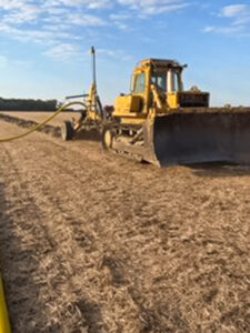 Gerding contracting working on farm drainage in a field.