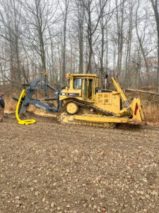 CAT excavator outdoors on a fall day.